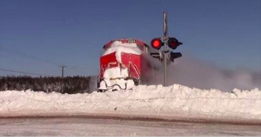 Speeding Train Smashes Into A Wall Of Snow And Man Records It All