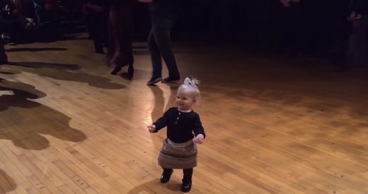 Little Girl Dances Around In The Middle Of Ballroom Showcase