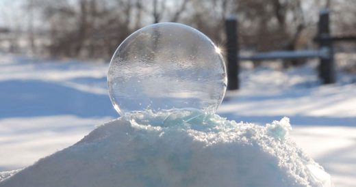 Freezing Air Transforms Bubble On Pile Of Snow