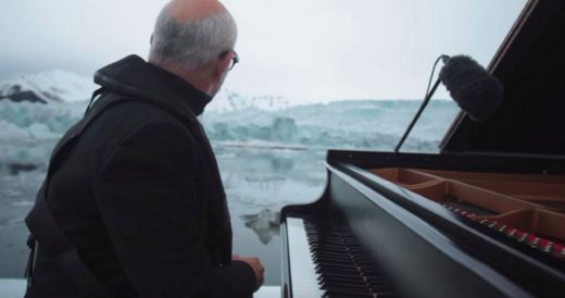 Man Plays Piano On Frozen Ocean