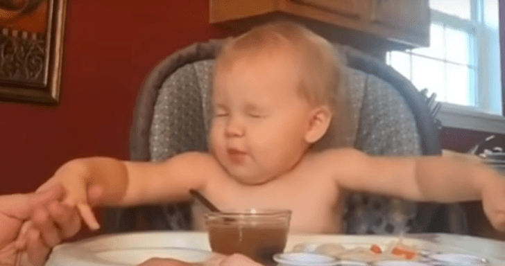 Family Prays Before Meal And Baby Tries To Keep Up