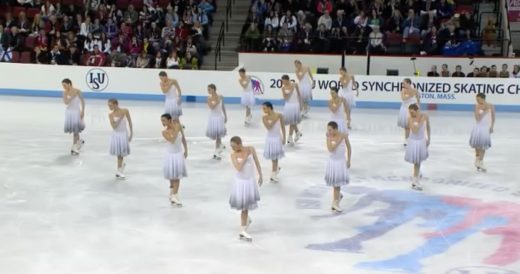 16 Skaters Glide Across The Ice In Sync