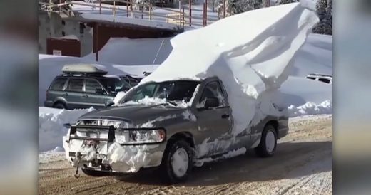 Skier Drives With Giant Iceberg On Top Of Truck