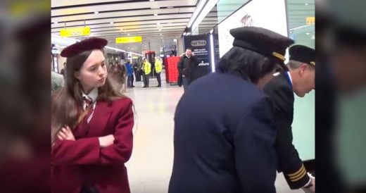 Girl Is Playing Piano At Airport When Two Pilots Join In