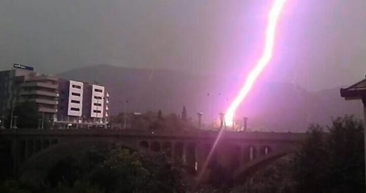 Man’s Pulls Camera Out Seconds Before Lightning Bolt Strikes A Bridge