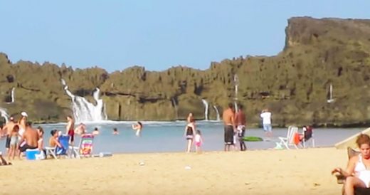 Beachgoers Stare Down A Huge Wave