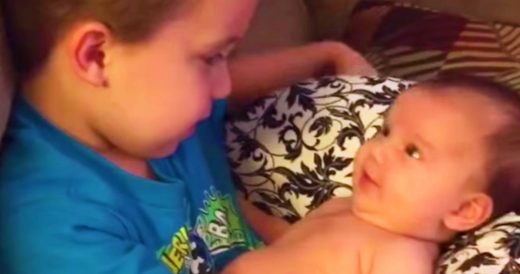 Big Brother Holds Little Sister For The First Time And Bursts Into Song