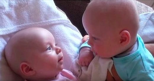 Twin Babies Make Eye Contact While Deep In Conversation