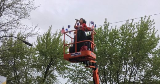 Woman Rents Cherry Picker To Sing To Senior Citizens While Remaining Socially Di...