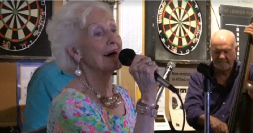 97-Year-Old Woman Sings Anthem For Her Neighbors