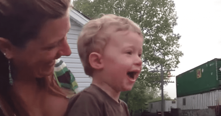 Toddler Is Enthralled When He Sees His Dad Driving The Passing Train