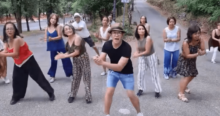 High Energy Line Dancers Move Along To Bee Gees’ “Night Fever”