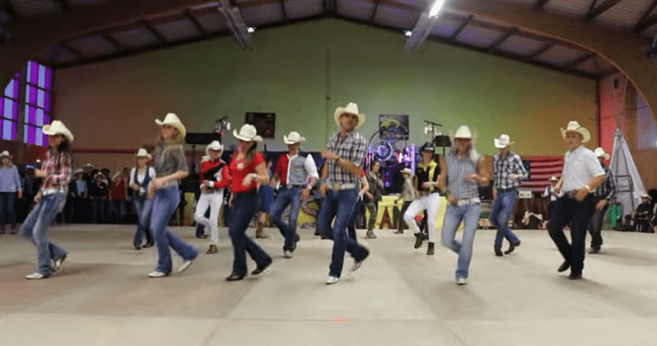 Choreographer And Crew Dress As Cowboys And Line Dance To “Footloose”