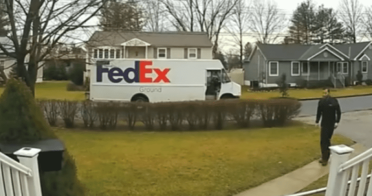 FedEx Driver Stops To Fold Fallen American Flag In Front Yard